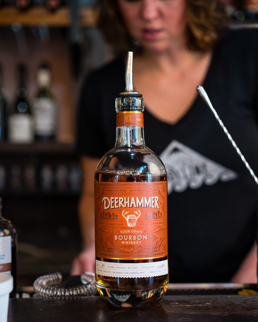 Bartender pouring Deerhammer bourbon, distilled in Buena Vista