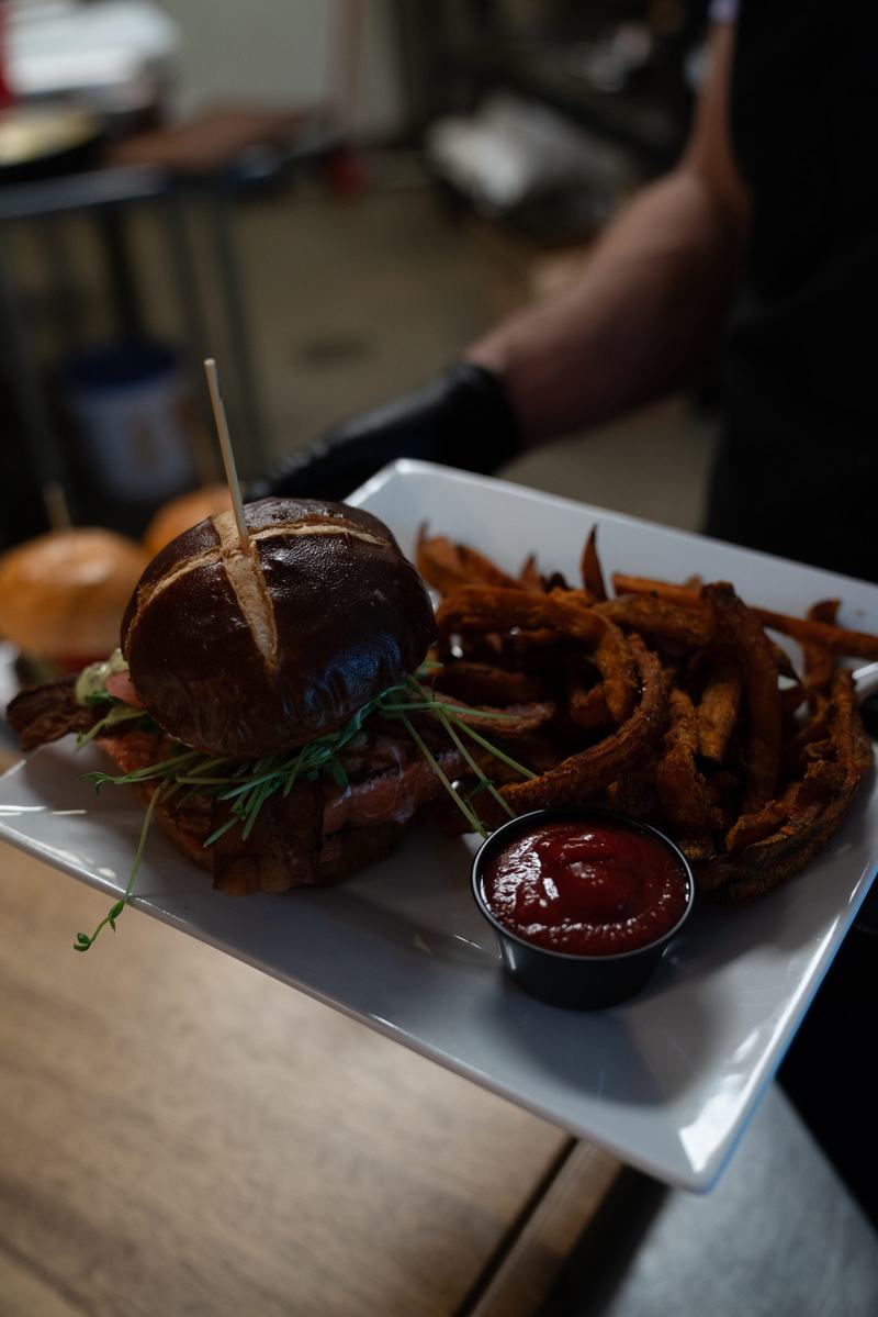 Stacked burger with fries and house sauce